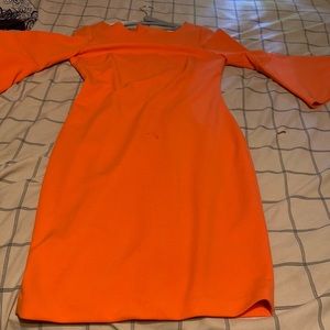 This is a very beautiful orange ,long sleeve, dress. The dress is made by Calvin